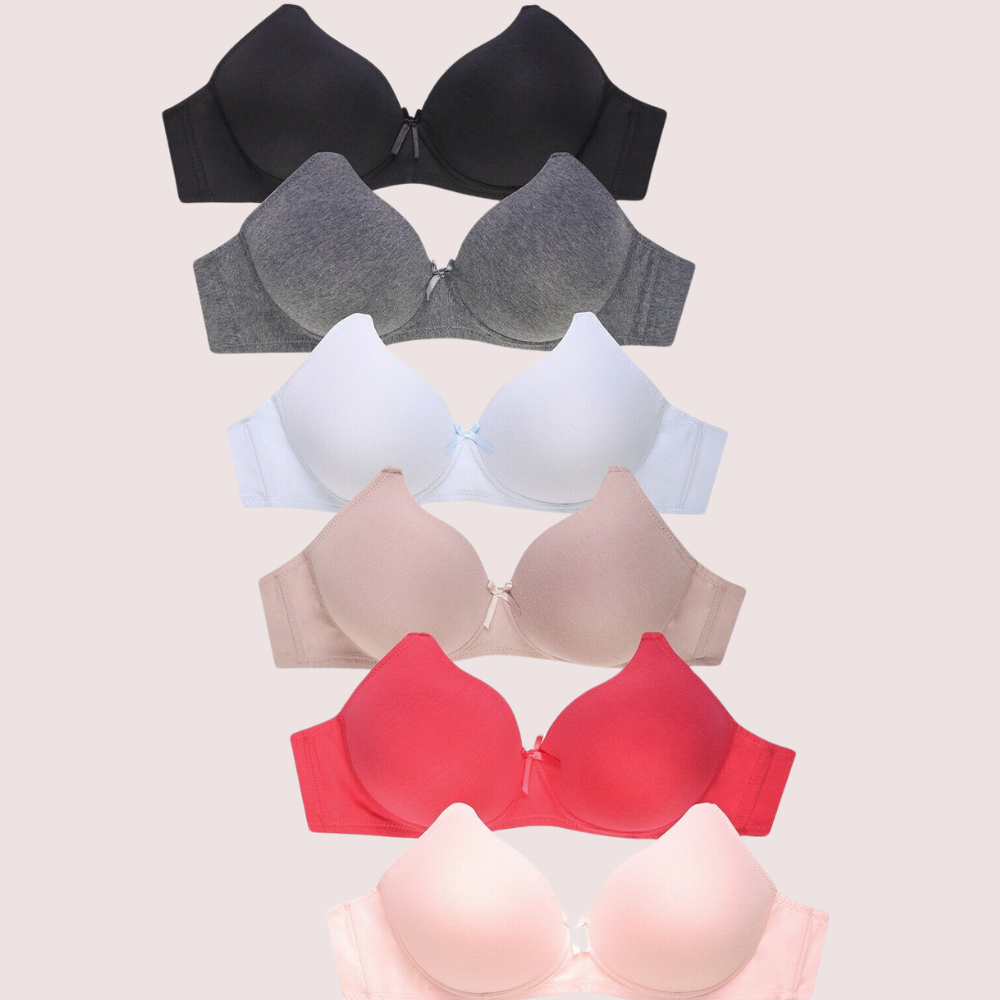 Set of five bras in black, gray, white, red, and pink on a light beige background