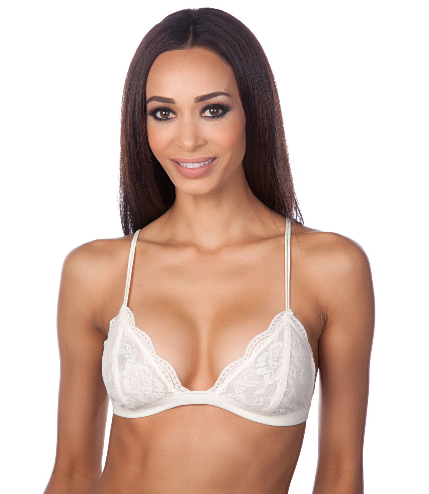 Woman wearing a white lace bra on a white background