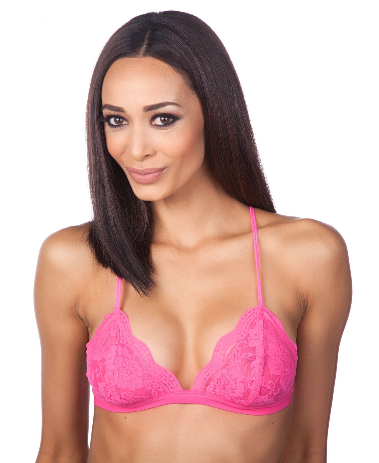 Woman wearing a pink bra against a white background