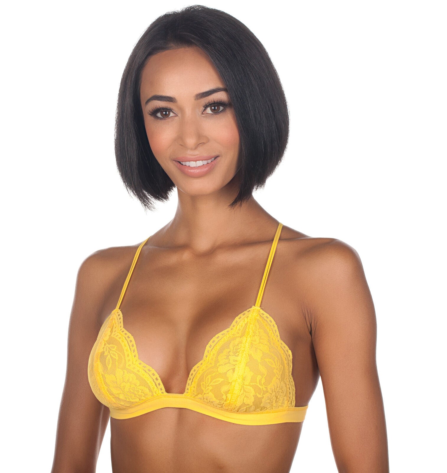 Woman wearing a yellow lace bra on a white background