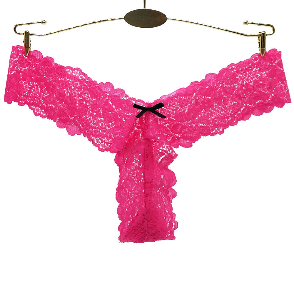 Pink lace thong on a white background