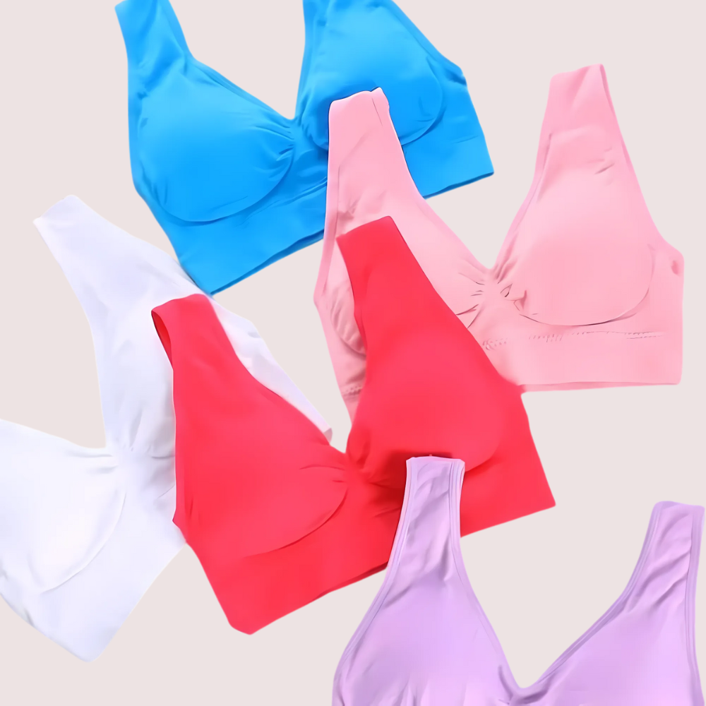 Four bras in blue, pink, red, and purple on a light beige background