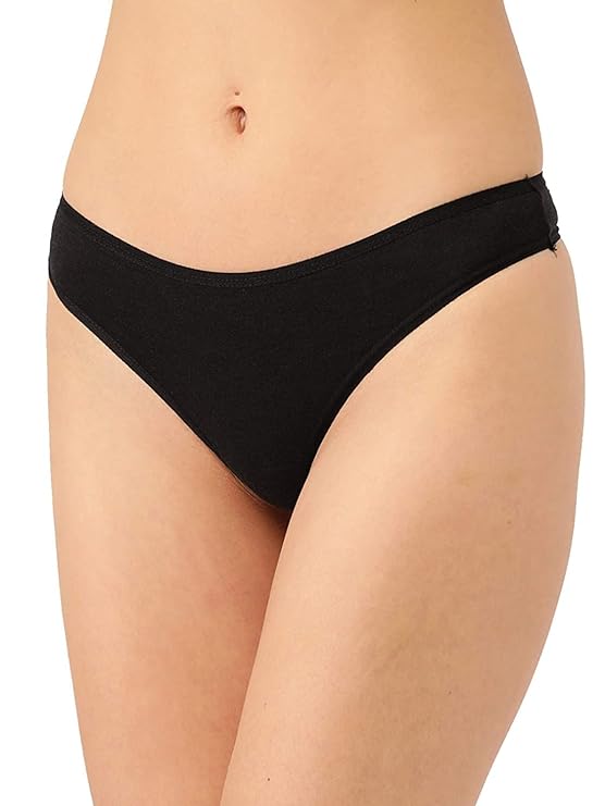 Black bikini bottom worn by a person on a white background