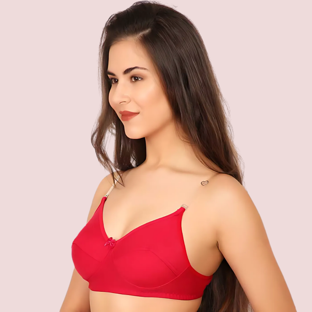 Woman wearing a red bra against a plain background