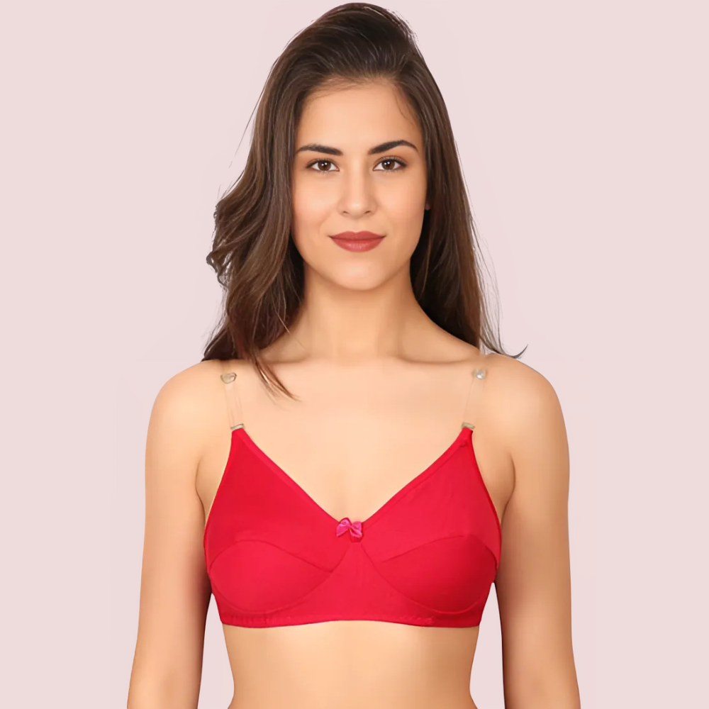 Woman wearing a red bralette against a pink background