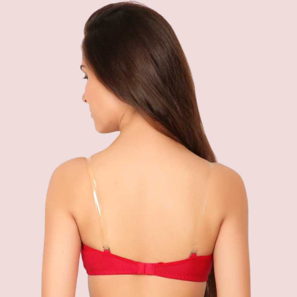 Woman wearing a red bralette against a light pink background