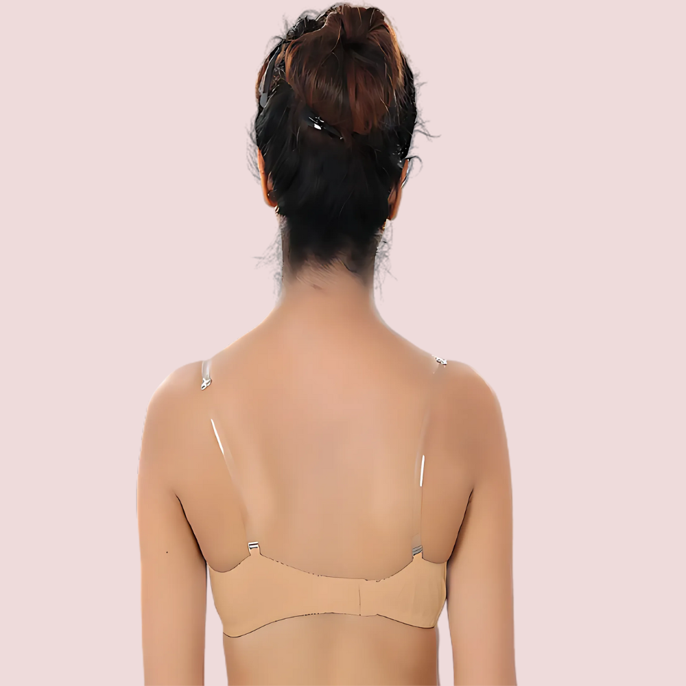 Beige bra worn by a person on a light pink background