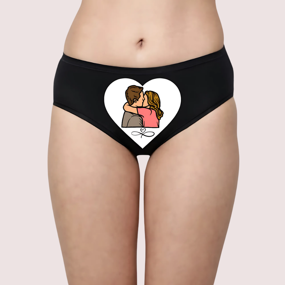 Black underwear with a heart design featuring a couple on a plain background