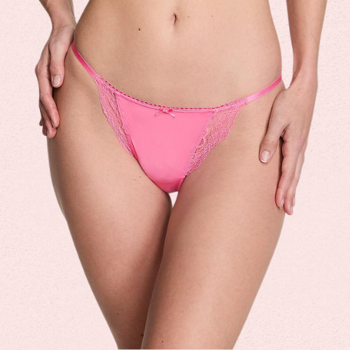Pink lace lingerie on a light pink background