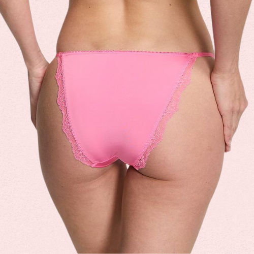 Pink lace underwear on a beige background