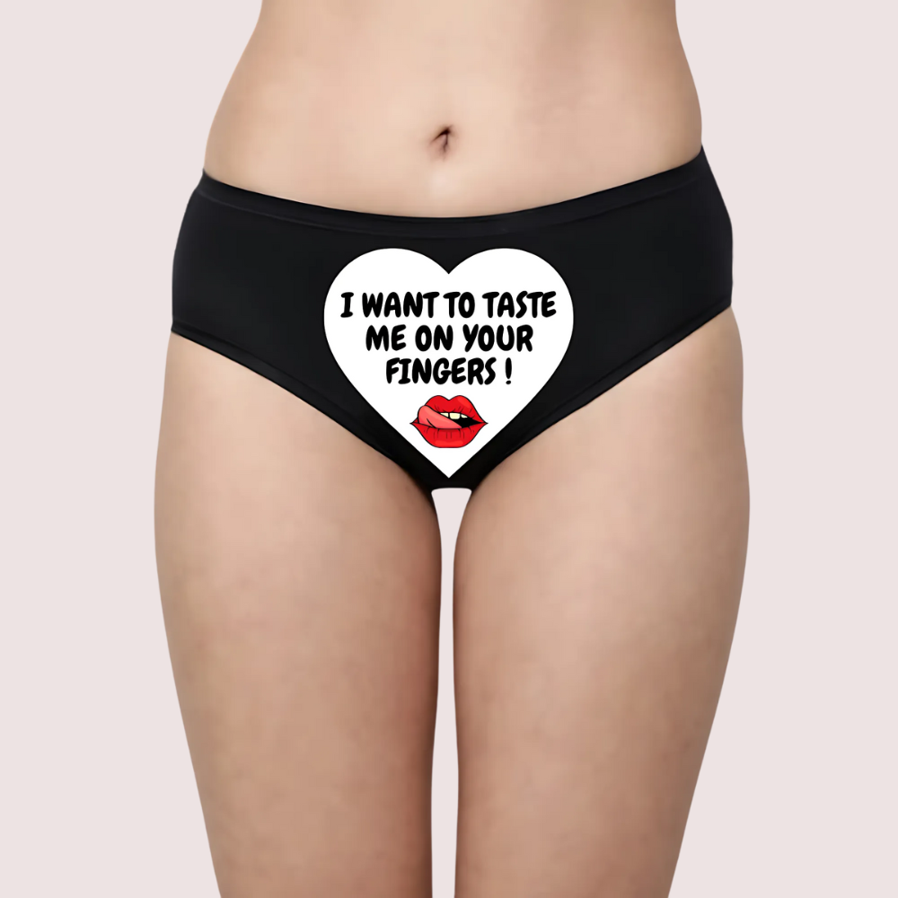 Black underwear with a heart design and text on a beige background