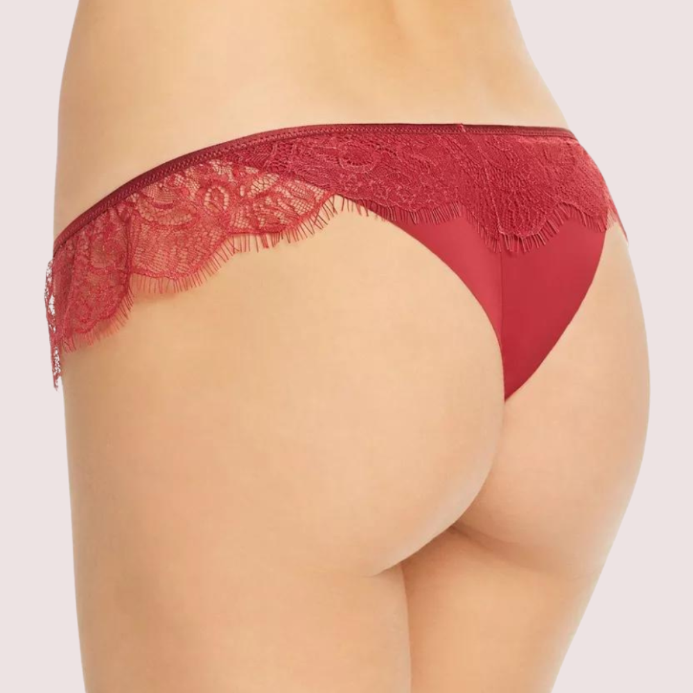 Red lace underwear on a plain background