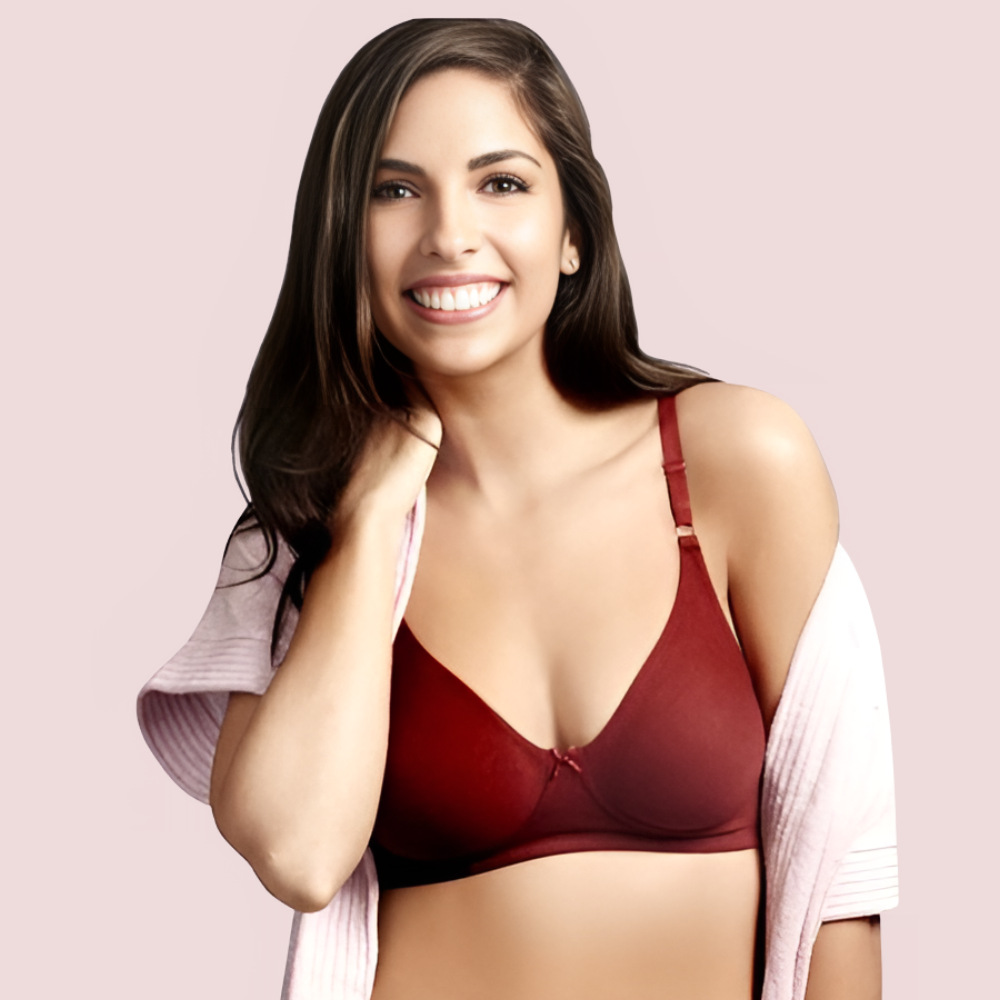Woman wearing a red bra against a pink background
