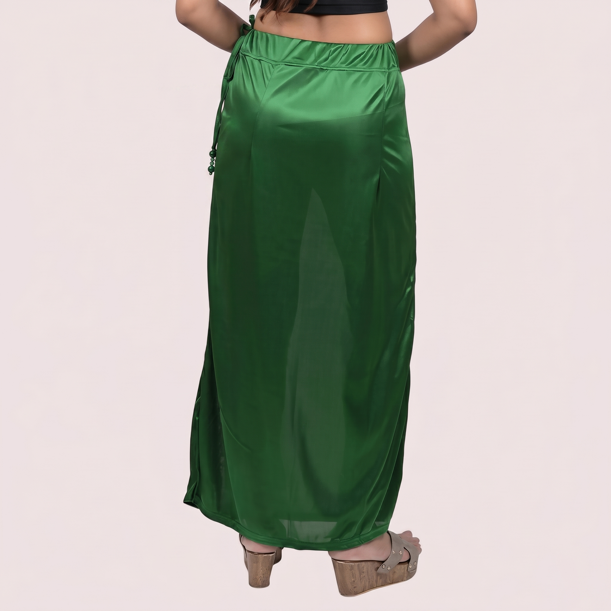 Green satin under skirt worn by a person 