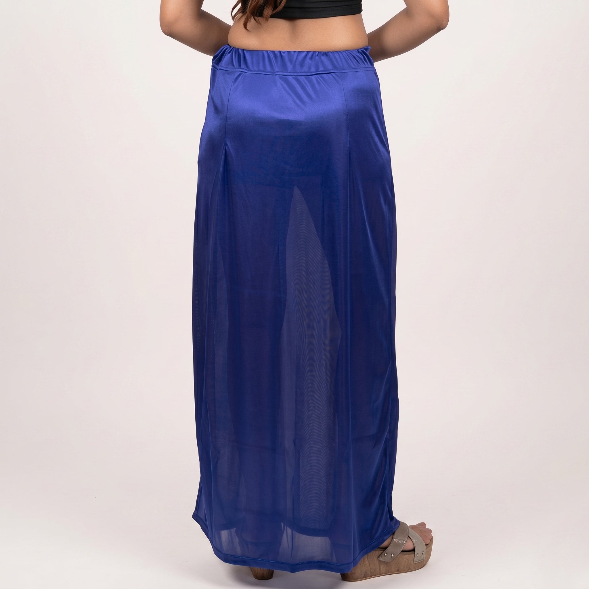 Person wearing a long blue petticoat
