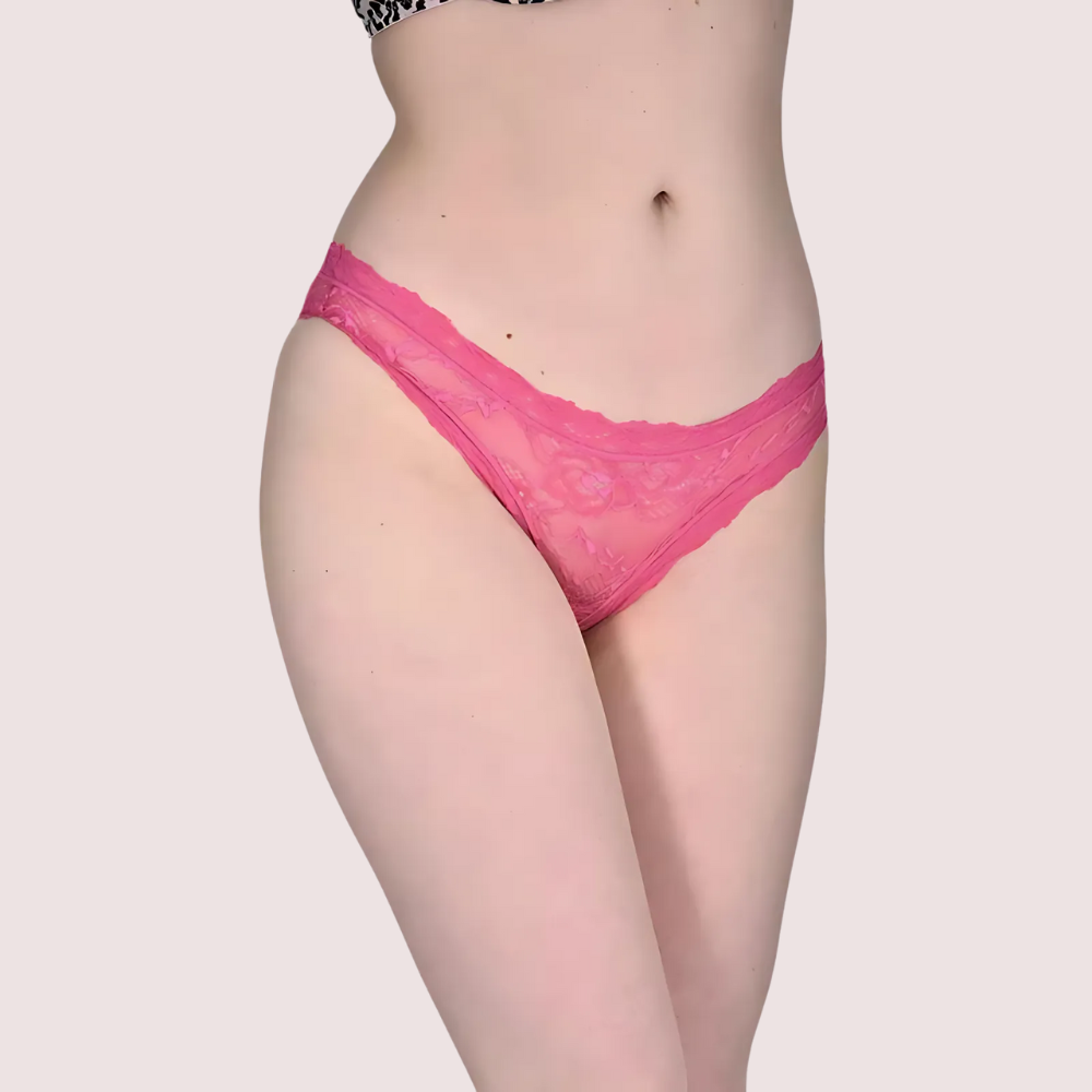 Person wearing pink lace underwear on a plain background