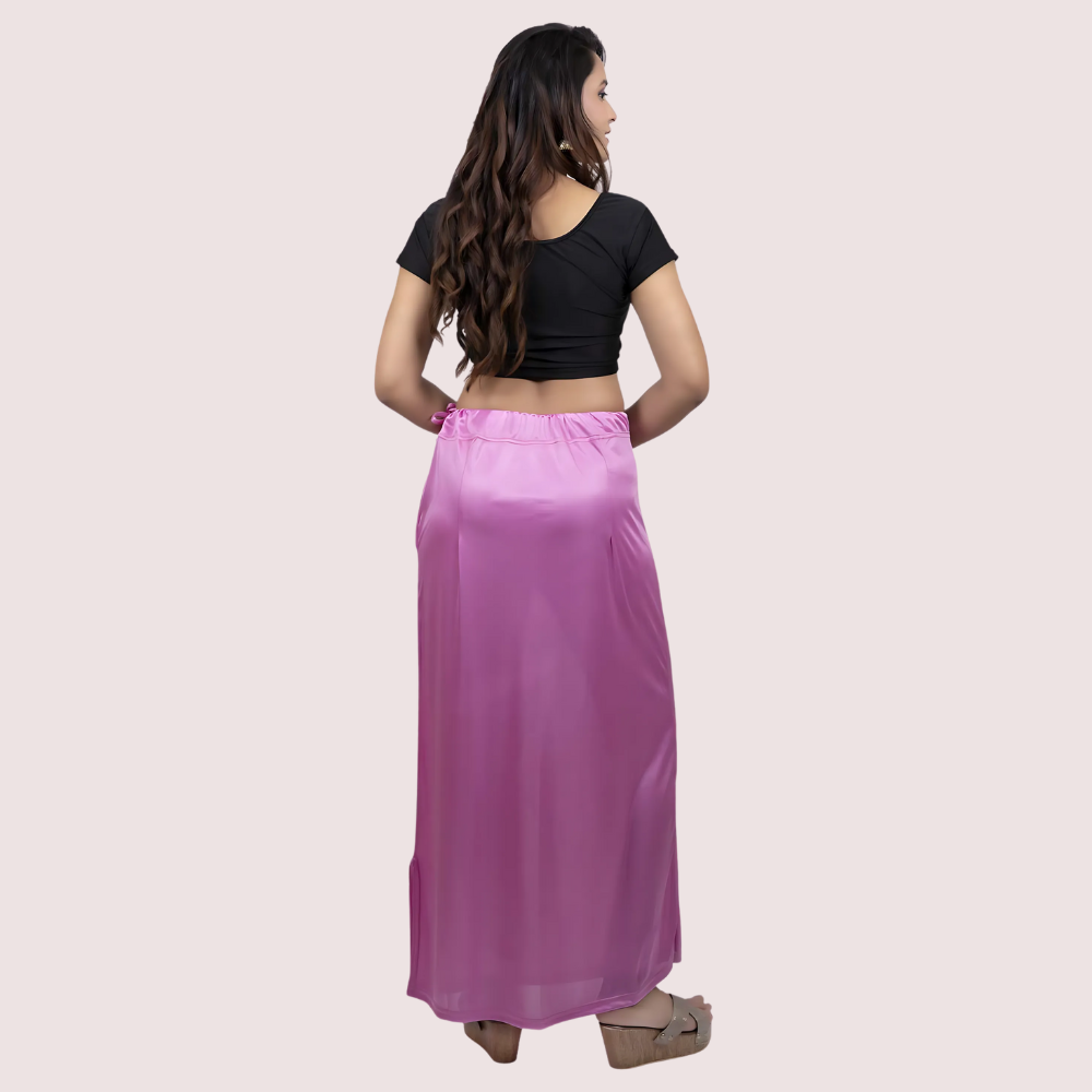 Woman wearing a black top and purple under-skirt 