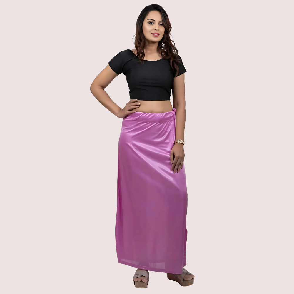 Woman wearing a black top and purple under-skirt 