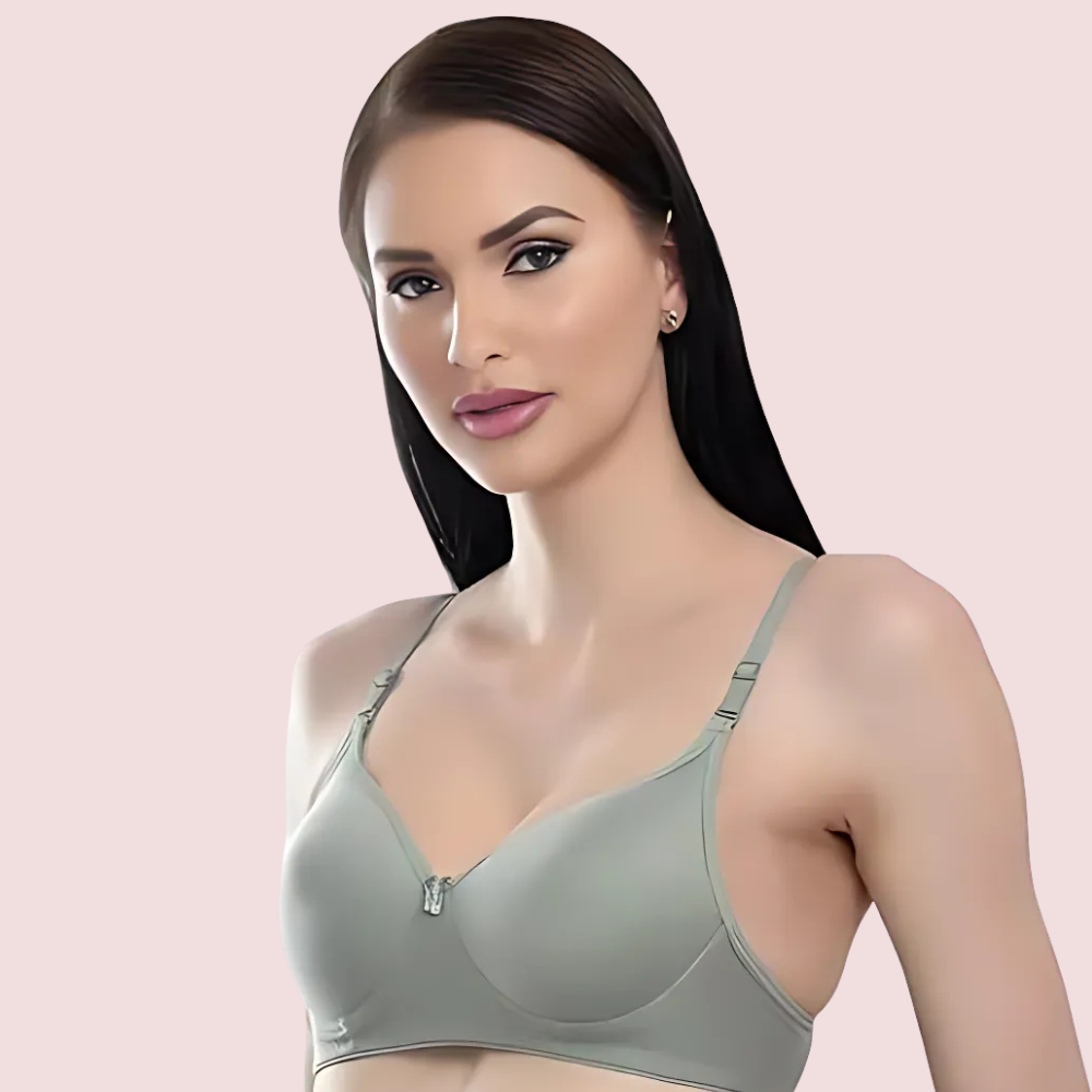 Woman wearing a gray bra on a pink background
