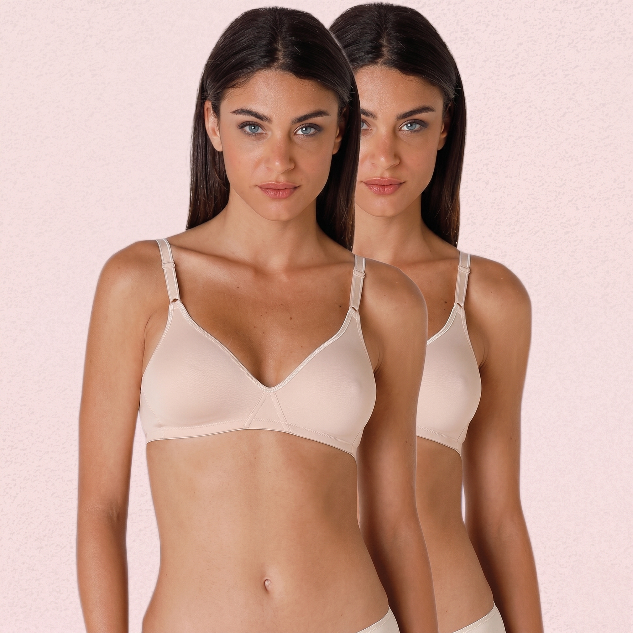 Woman wearing a beige bra against a pink background