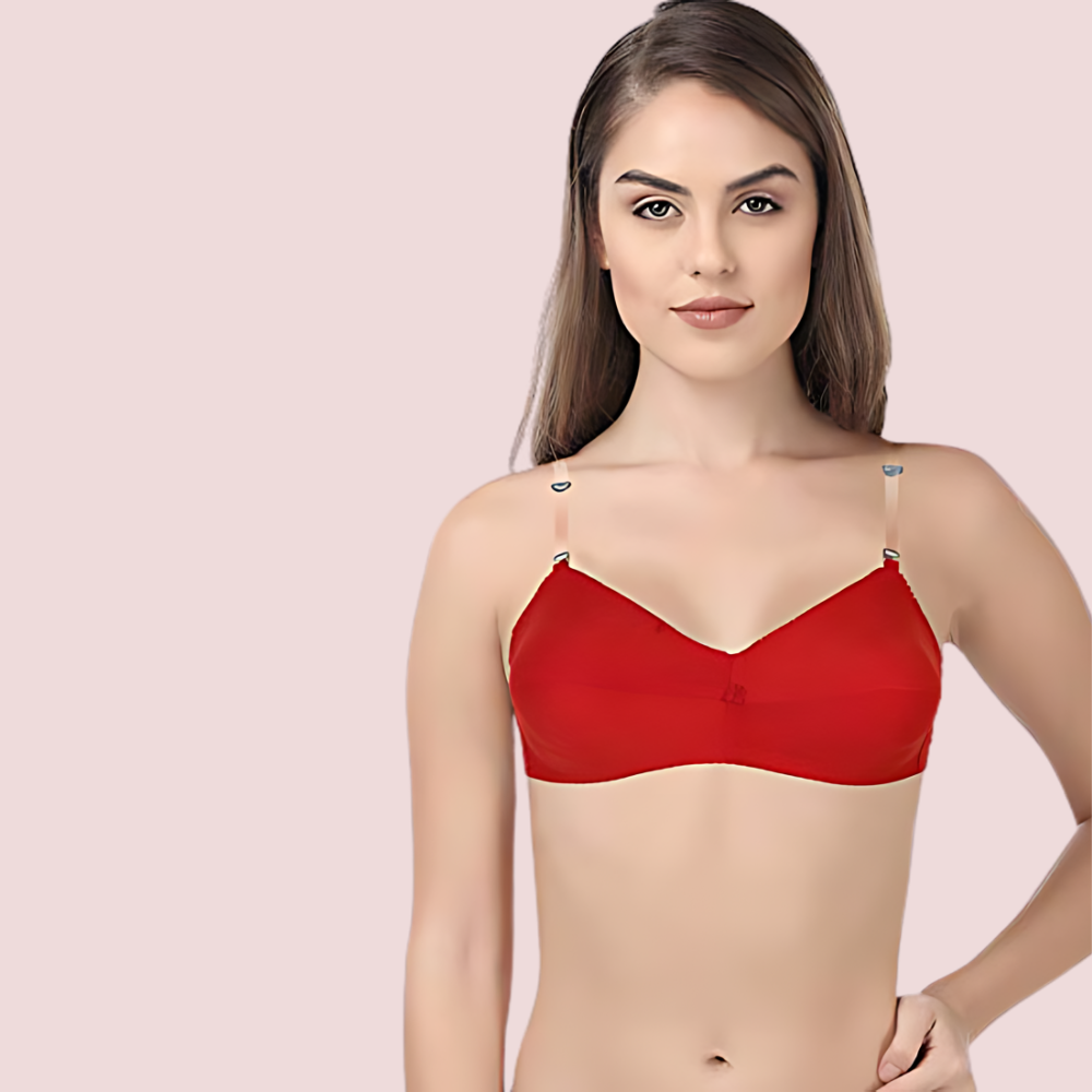Woman wearing a red bra against a pink background