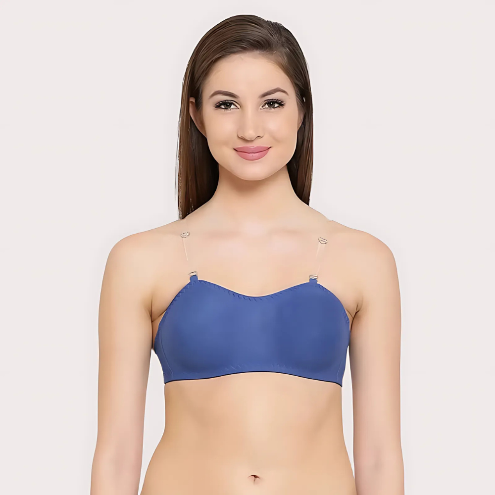 Woman wearing a blue bra on a light pink background