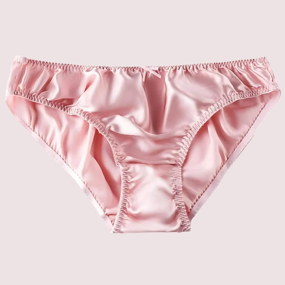 Pink satin underwear on a light gray background