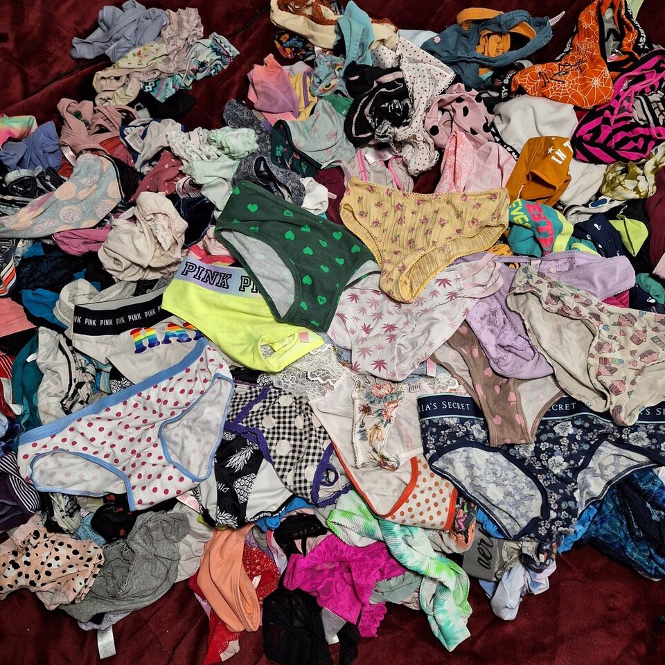 Large pile of variously patterned underwear on a dark background