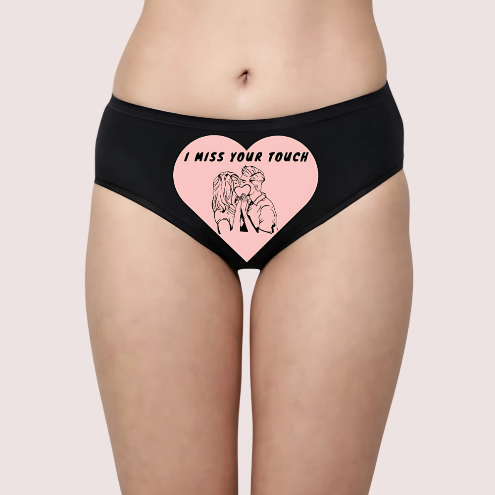 Black underwear with a heart design and text on a beige background
