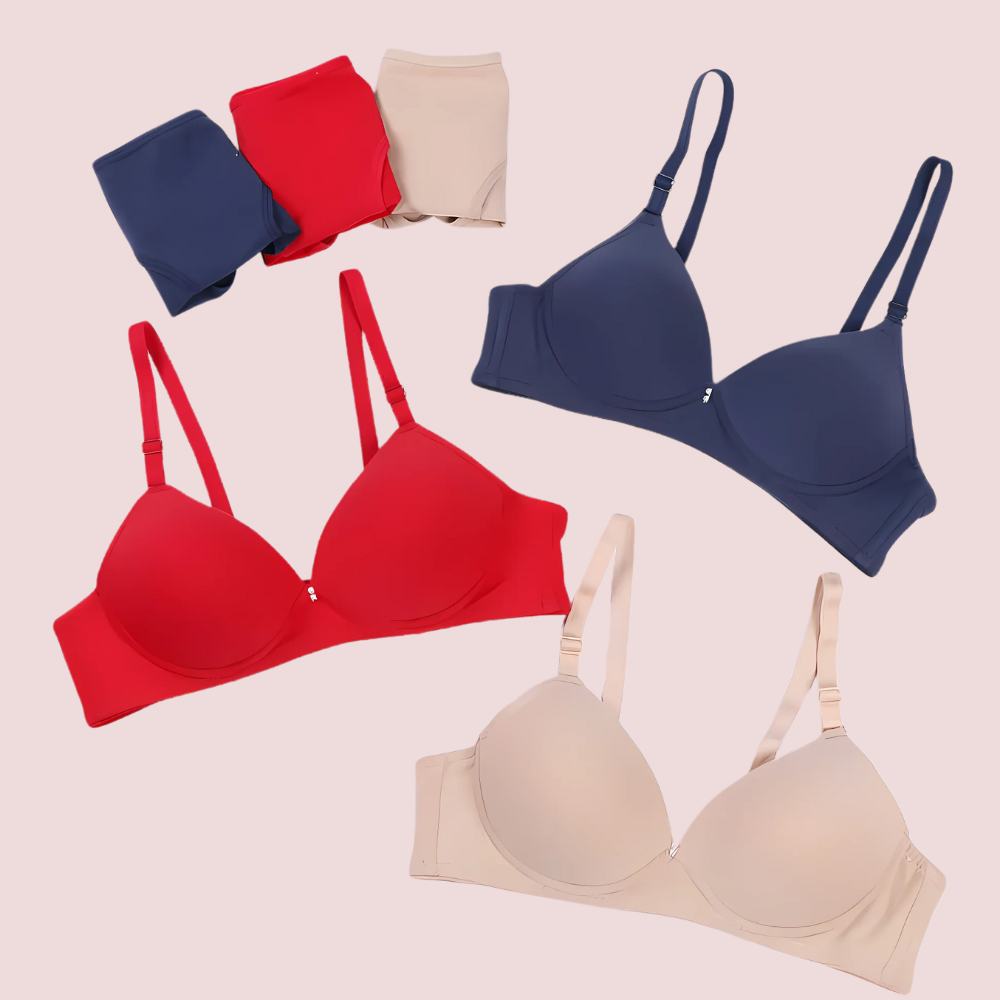 Set of red, blue, and beige bras on a light pink background