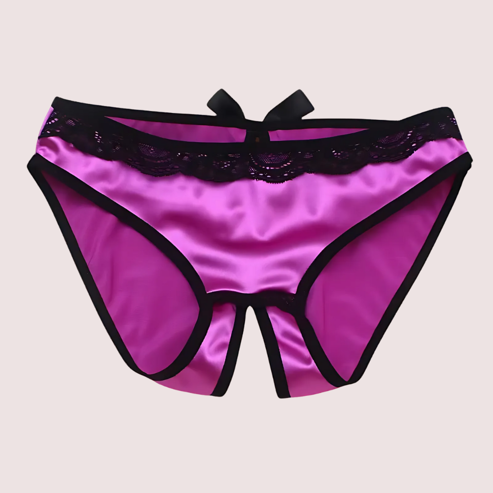 Purple satin underwear with black lace trim on a beige background