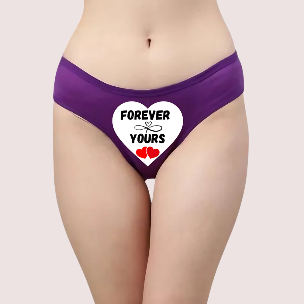 Purple underwear with 'Forever Yours' heart design on a plain background