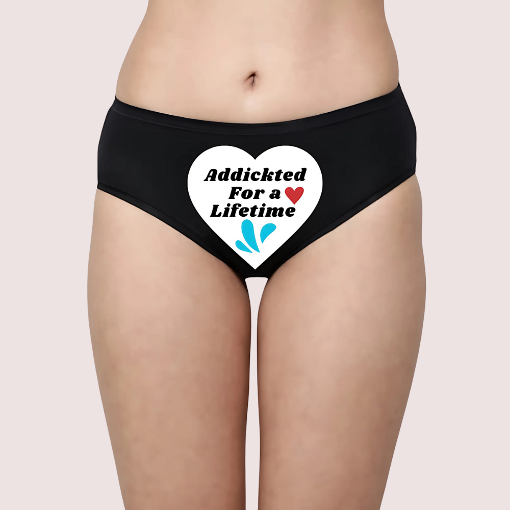 Black underwear with a heart-shaped graphic and text on a plain background