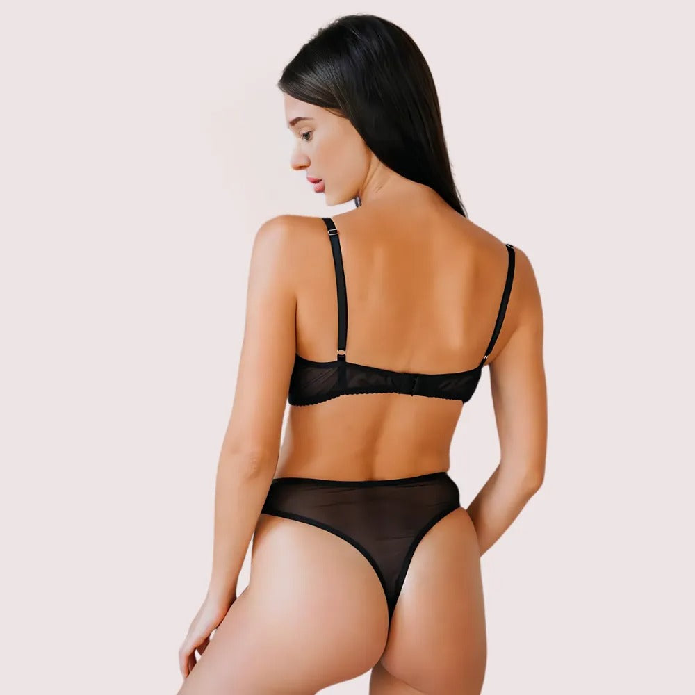 Woman wearing a black see through lingerie set 
