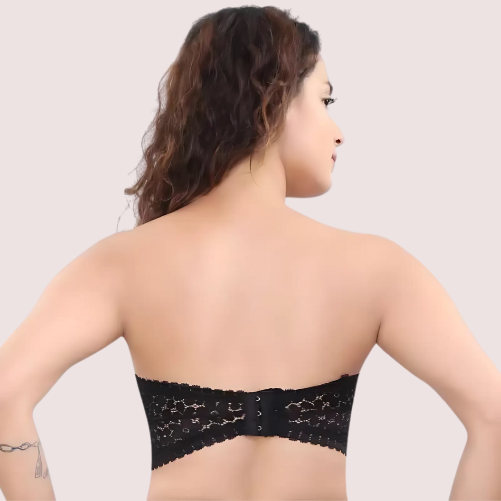 Black lace strapless bra worn by a model on a plain background