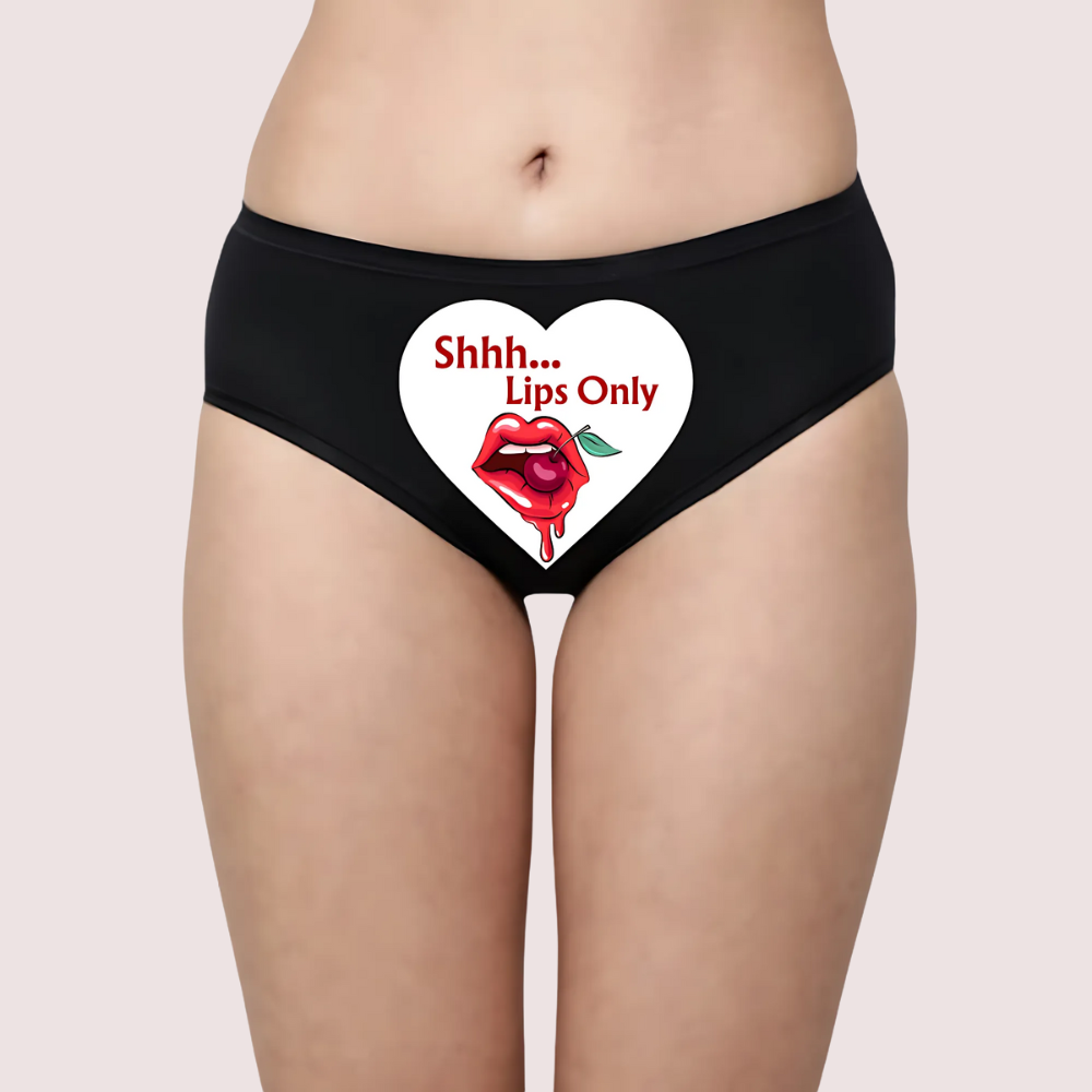 Black underwear with a heart design featuring lips and text on a beige background
