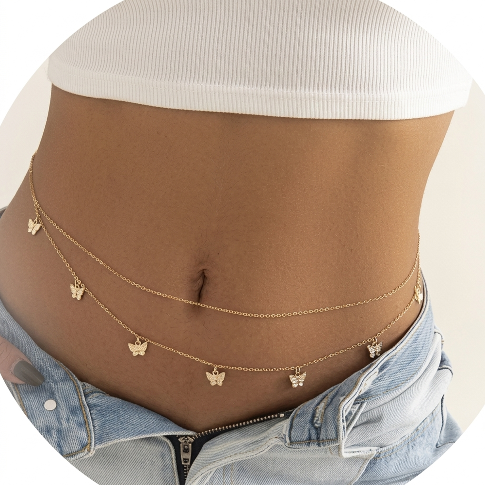 Gold chain with butterfly pendants on a person 