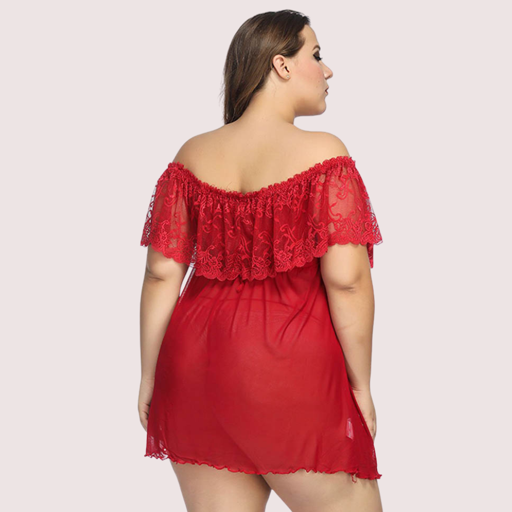 Red lace nightgown worn by a model on a plain background