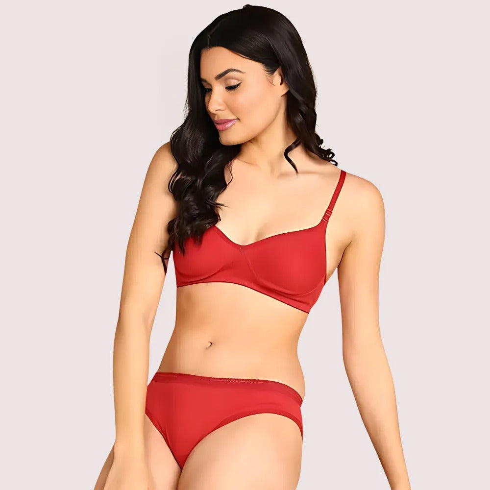 Woman wearing a red bikini on a plain background