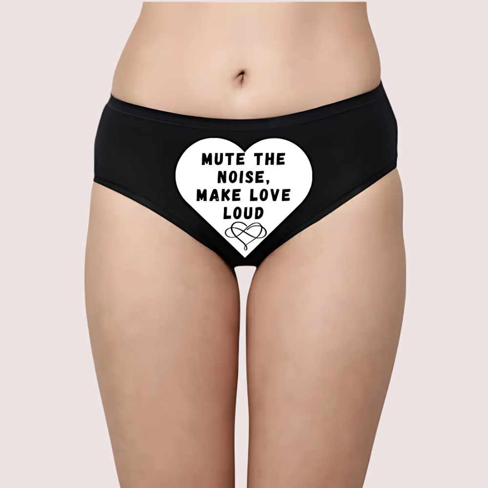 Black underwear with a heart-shaped design and text on a beige background