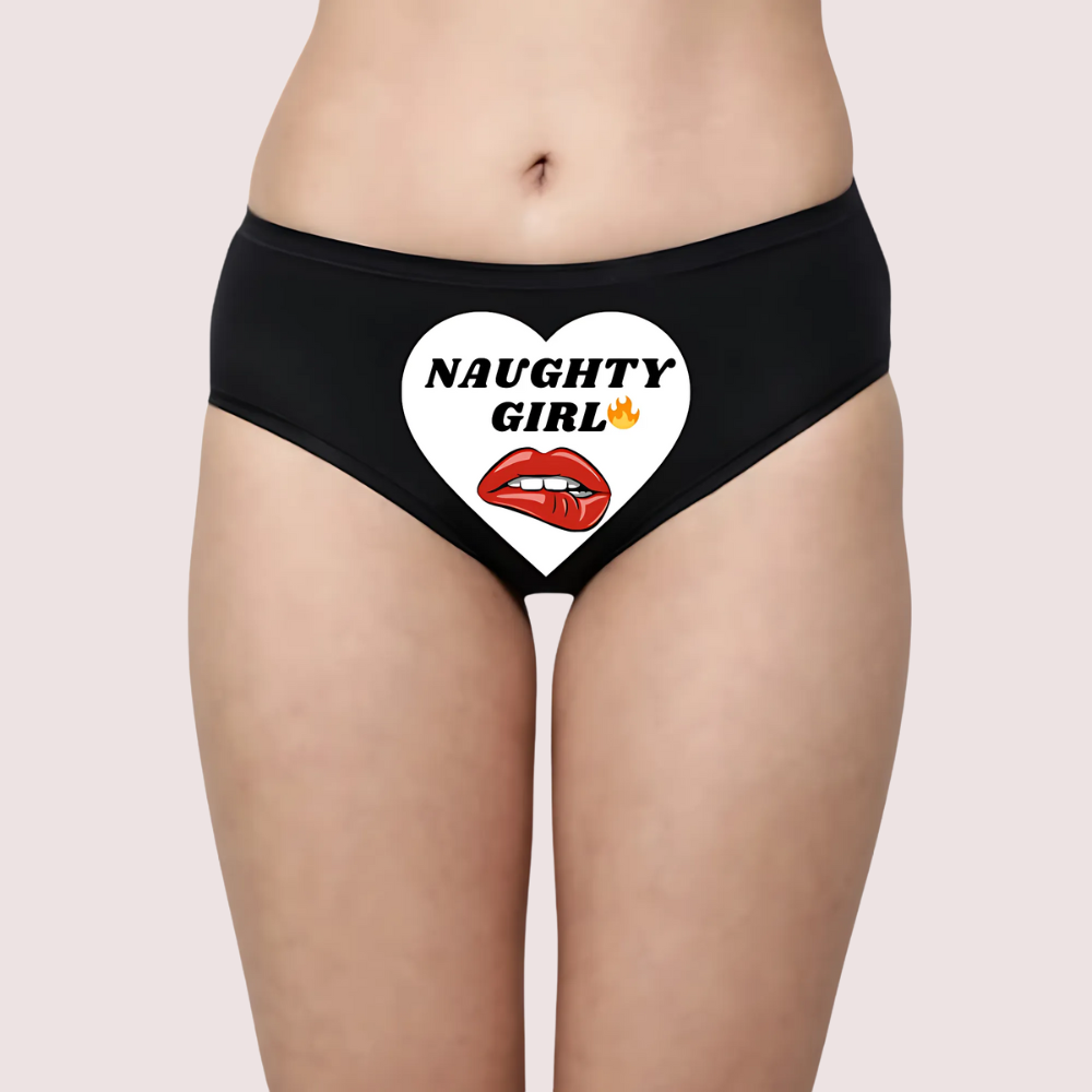 Black panty with 'Naughty Girl' heart design on a beige background