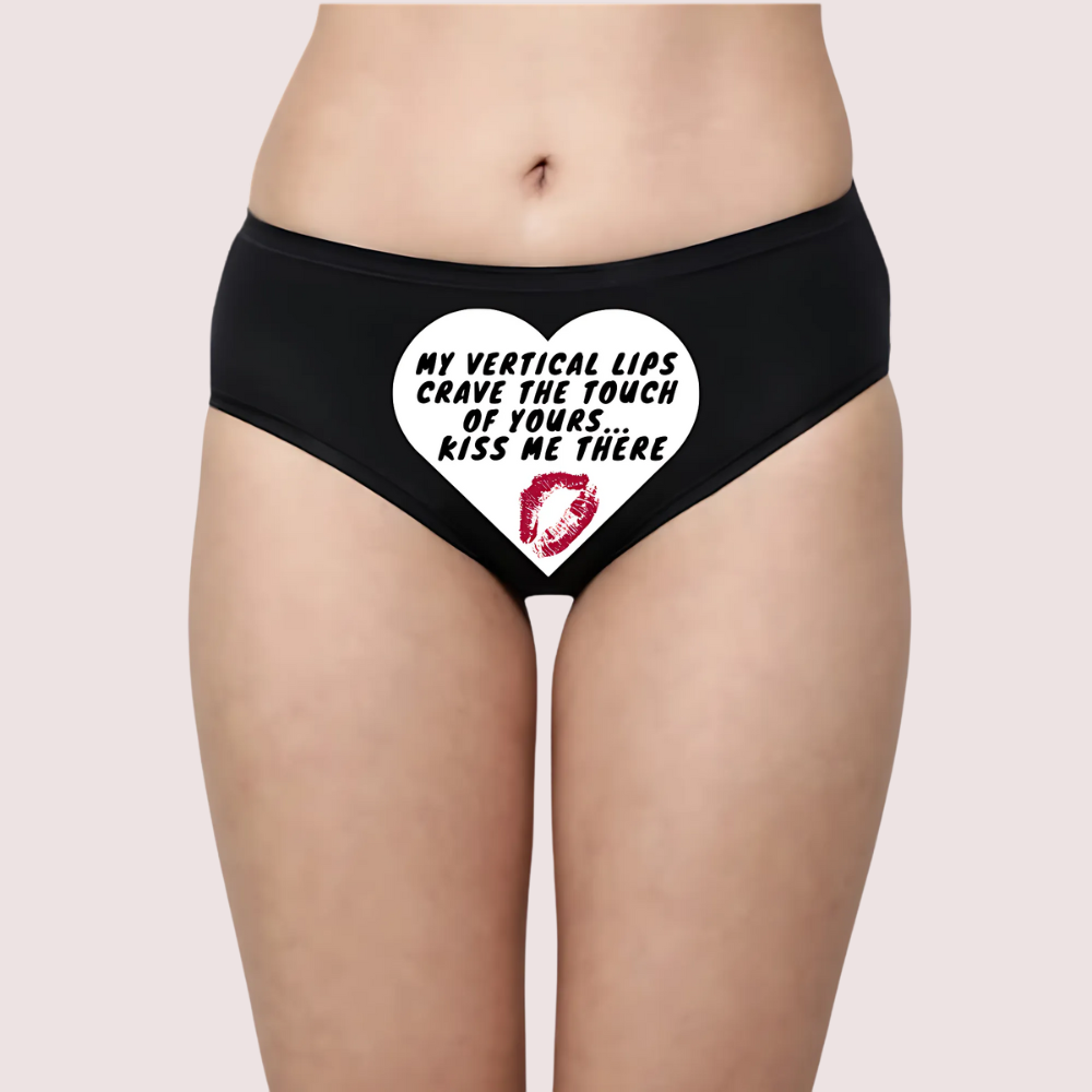 Black underwear with a heart design and text on a beige background