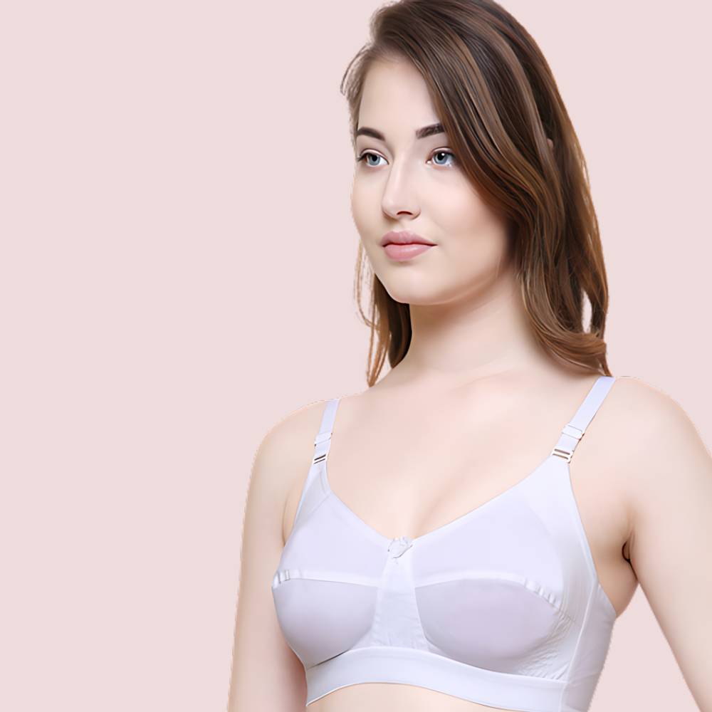 Woman wearing a white bra against a beige background