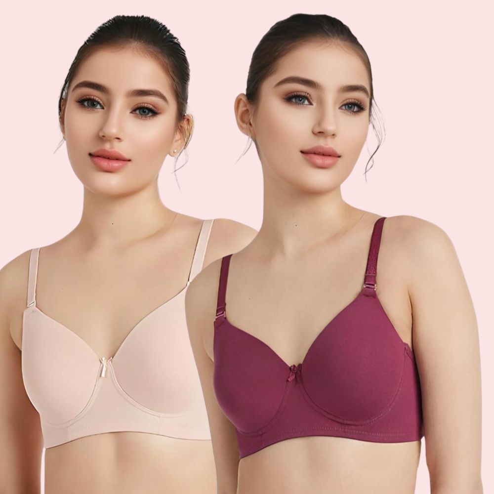 Two women wearing different colored bras on a pink background