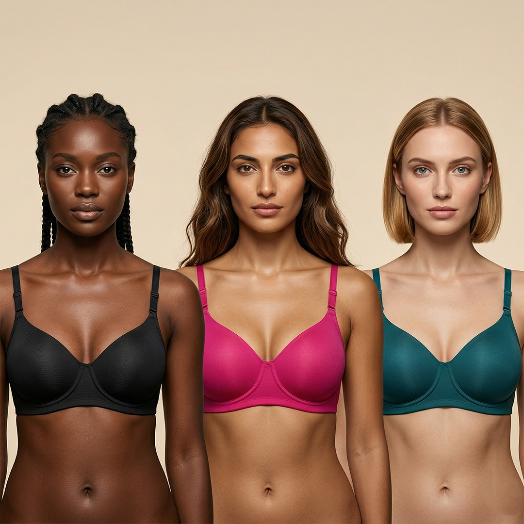 Three women wearing different colored bras against a beige background