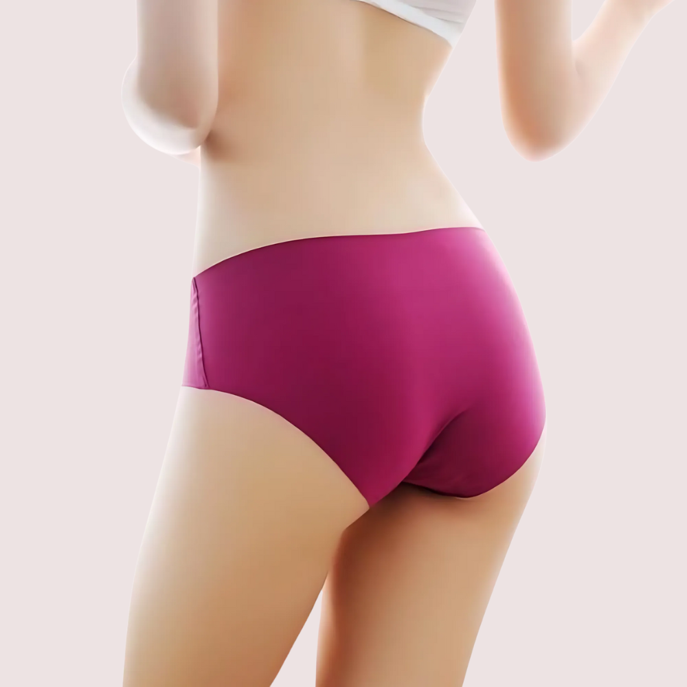 Purple underwear worn by a person on a light beige background