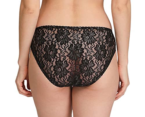 Black lace underwear worn by a model on a white background