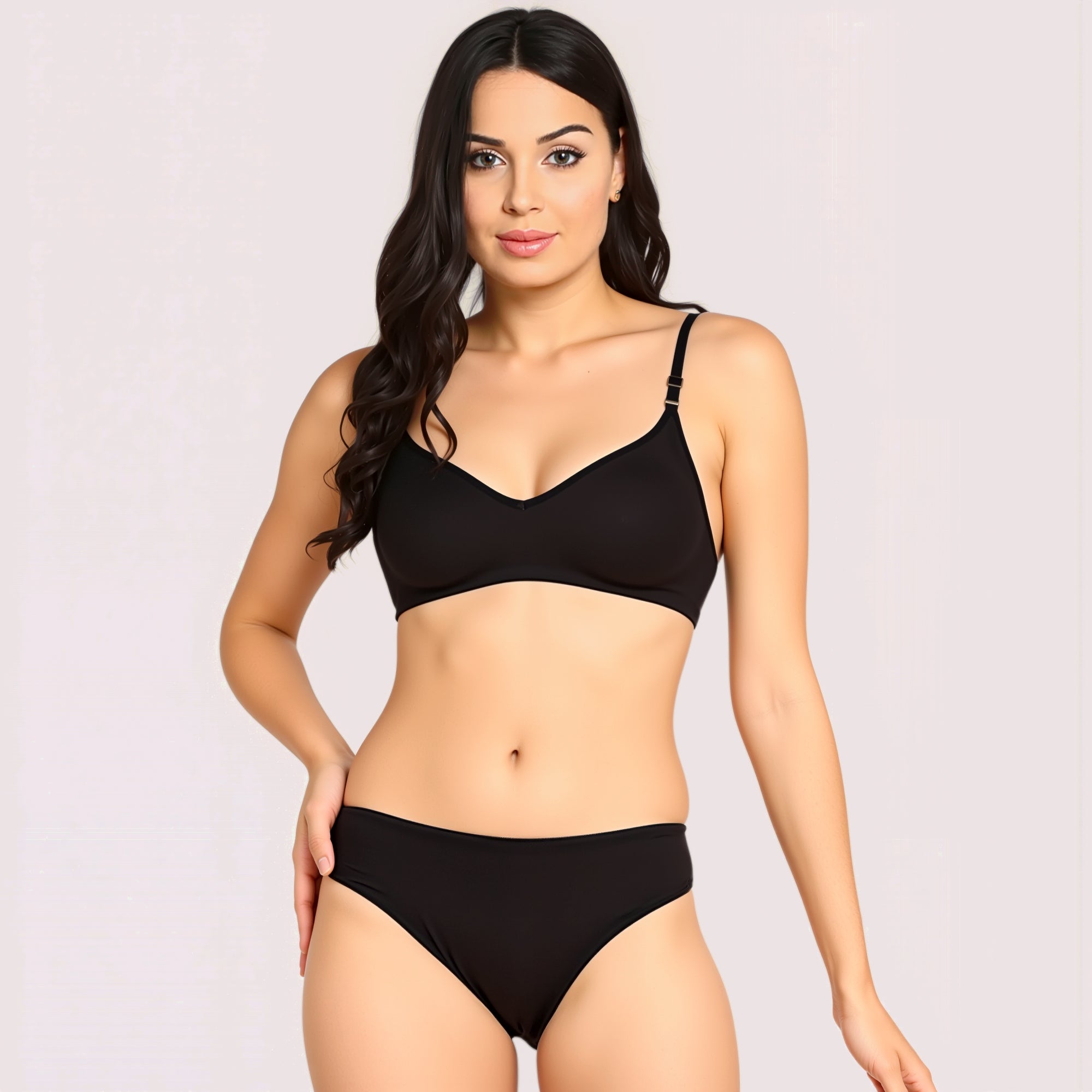 Woman wearing a black bikini set on a plain background