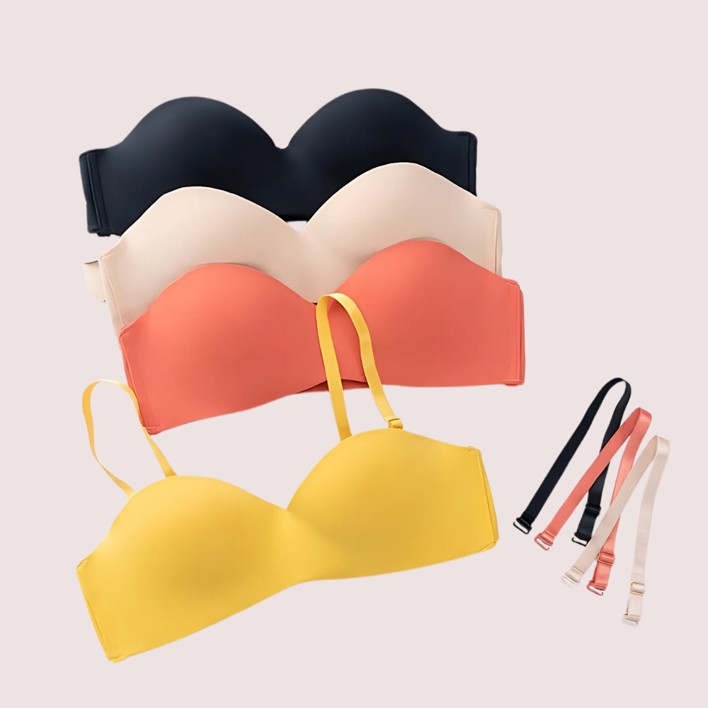 Set of colorful bras with straps on a light gray background