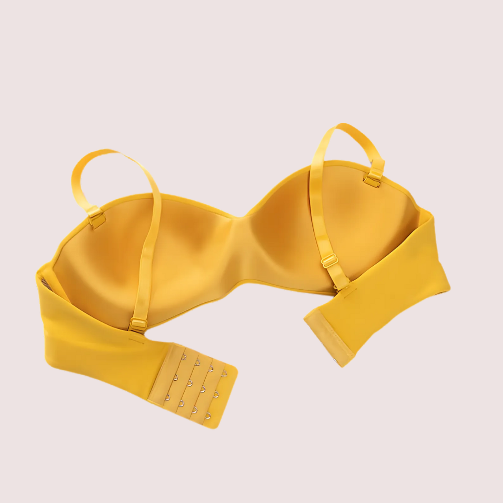 Yellow bra on a beige background